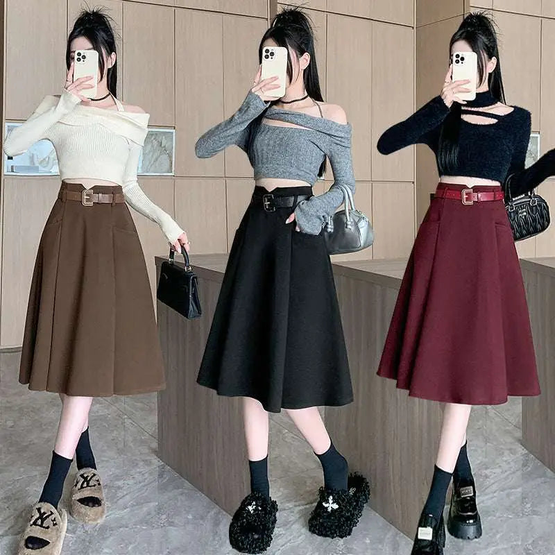 Three models showcase woolen umbrella skirt midi style in brown high waist black and burgundy with matching belt