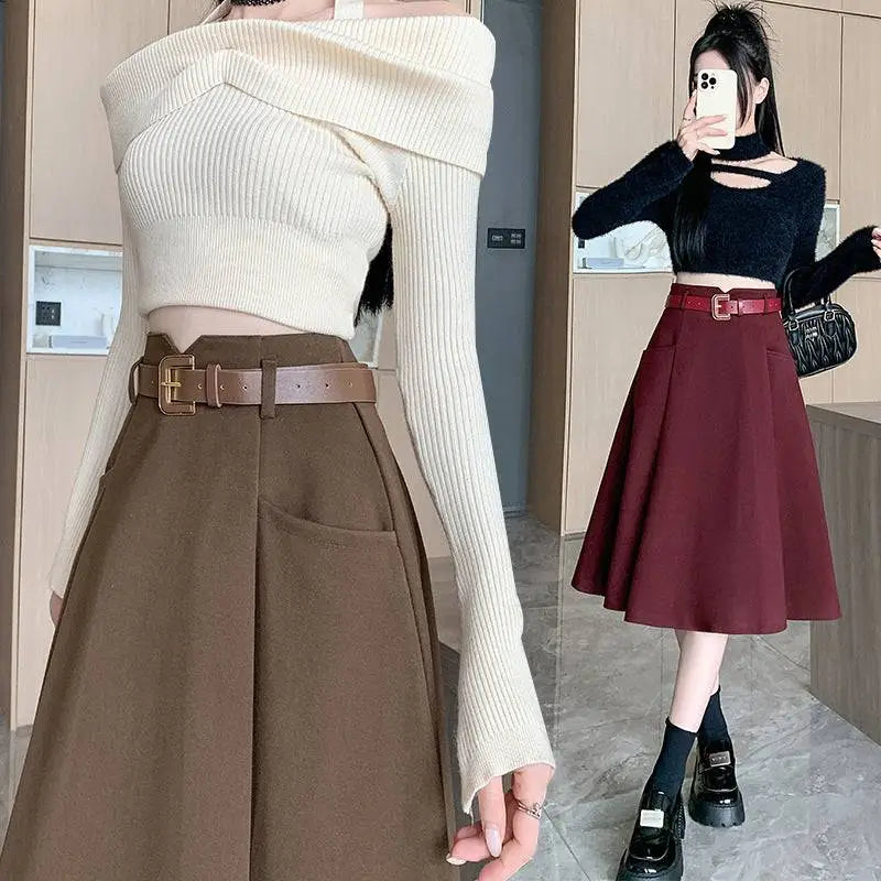 Off-the-shoulder cream ribbed knit crop top paired with brown high waist woolen umbrella skirt with matching belt