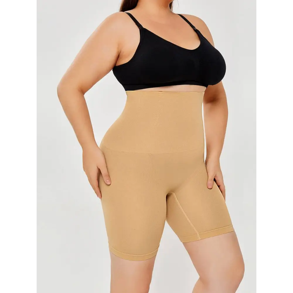 Beige high waisted body shaper shorts with seamless design and supportive fabric for smooth contouring