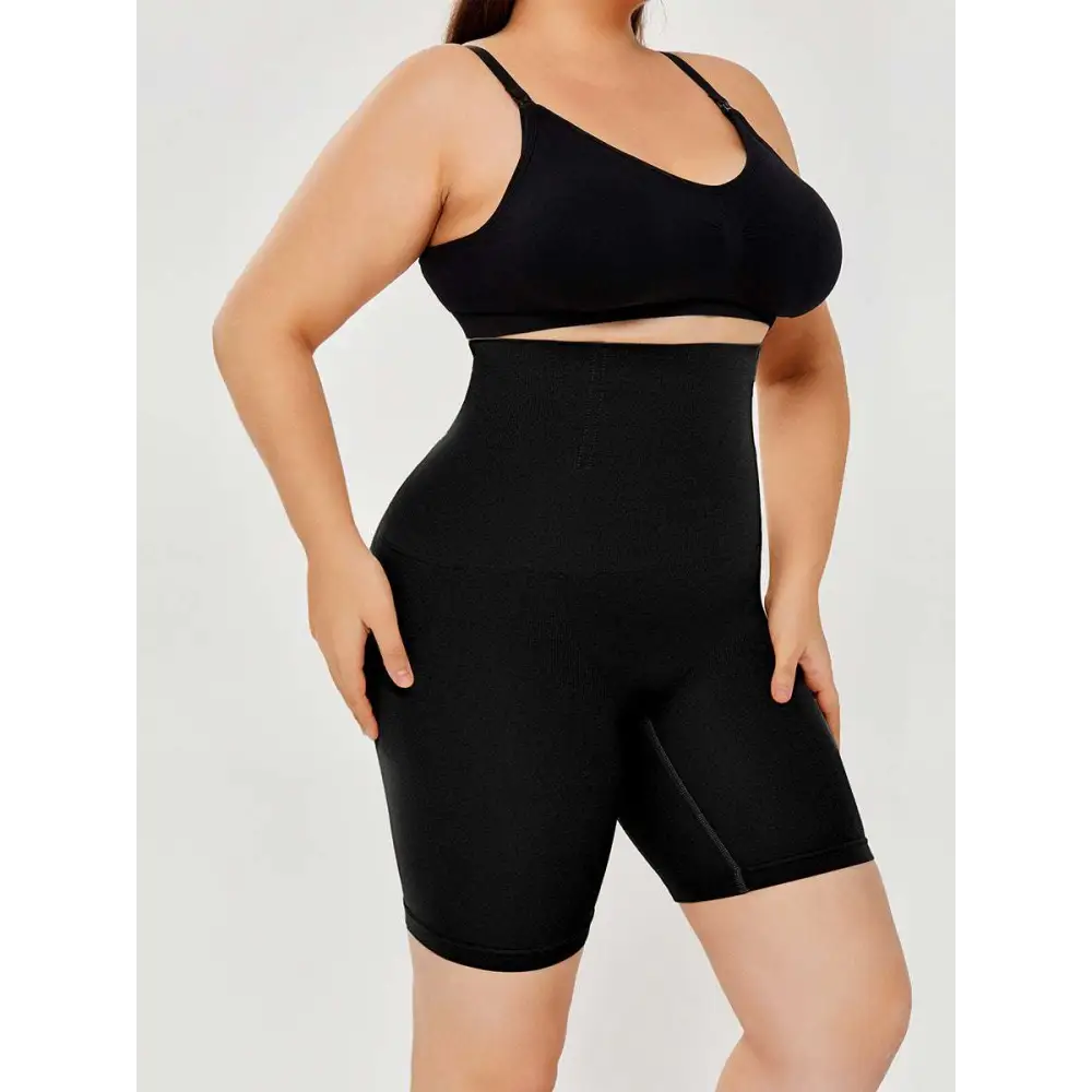 Black high waisted body shaper shorts with a seamless design for a smooth and form fitting silhouette
