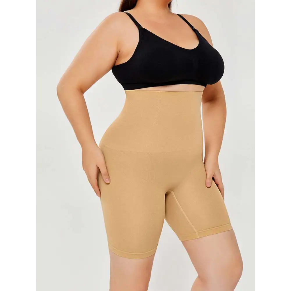 Beige high waisted body shaper shorts with a smooth seamless design for comfortable shaping and support