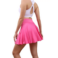 Bright pink high waisted womens pleated tennis skirt with pockets designed for comfort and performance