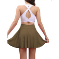 Olive green high waisted womens tennis skirt with pleated design and pockets for athletic use