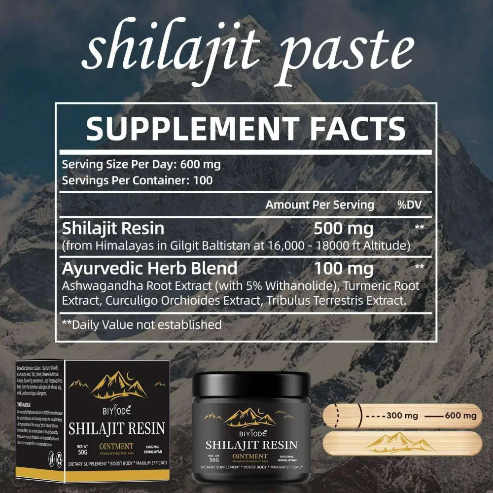Black jar of himalayan shilajit resin ointment with gold mountain logo, matching box, and wooden applicator sticks for shilajit gummies