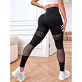 Black high-waisted hollow seamless yoga pants with mesh panels on thighs and calves for yoga pants training