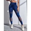 Deep blue high-waisted hollow seamless yoga pants with mesh panels on thighs and lower legs for training