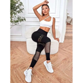 Black high-waisted hollow seamless yoga pants with mesh panels featuring a seamless fit for yoga pants training
