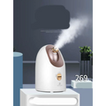 White and rose gold dual mode device facial steamer offering hot and cold face steaming with a sleek rounded design