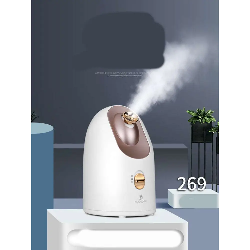 White and rose gold dual mode device facial steamer offering hot and cold face steaming with a sleek rounded design