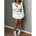 White long-sleeved crop top paired with fashionable stringy selvedge patchwork ruffled mini skirt set