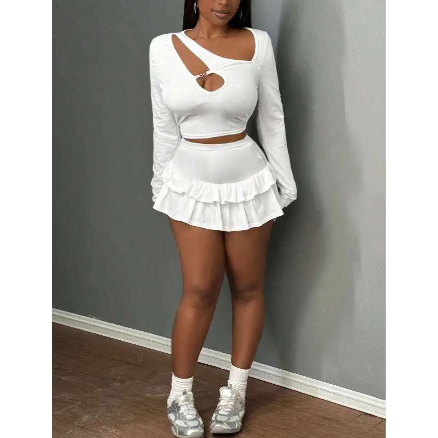White long-sleeved crop top paired with fashionable stringy selvedge patchwork ruffled mini skirt set