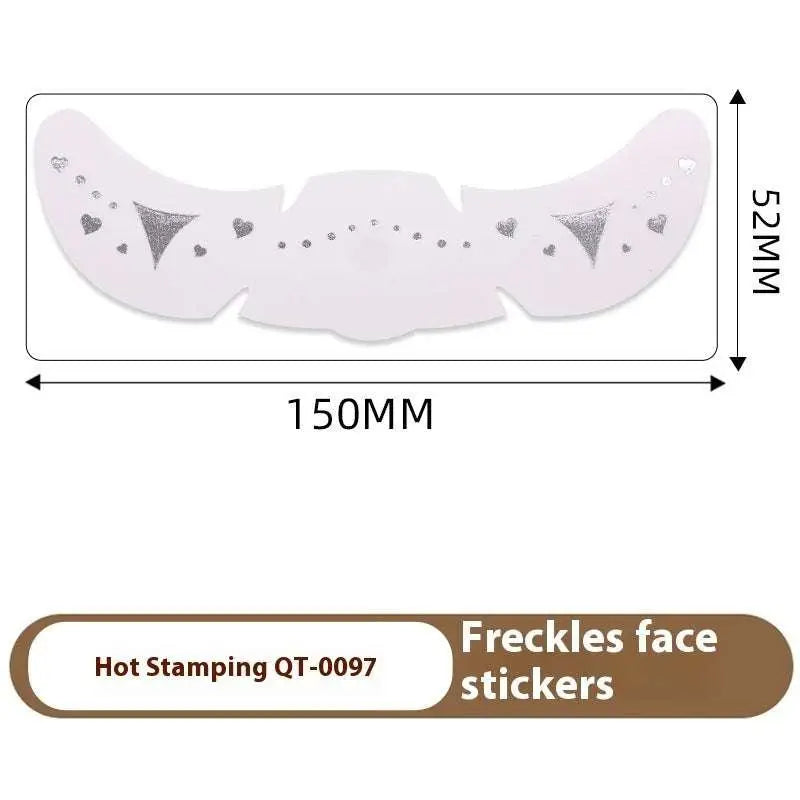 Silver hot-stamped freckle tattoo stickers with heart and triangle designs on pale pink base for stamping heart freckle look