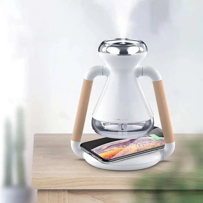White and wood-handled humidifier usb wireless glass aroma diffuser with glass tank emitting mist and charging smartphone