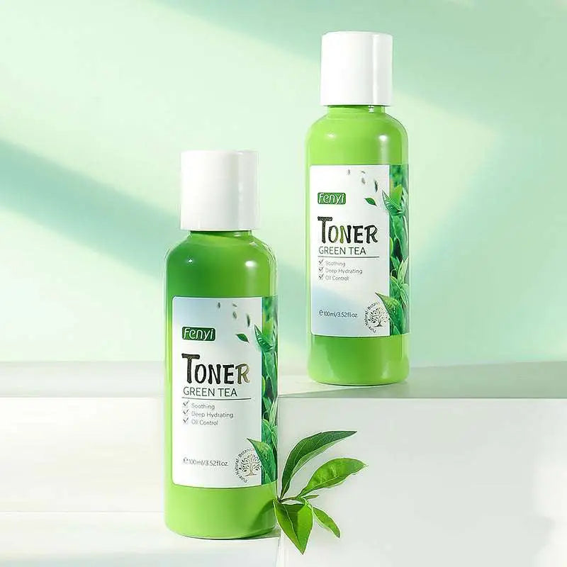 Green glass bottles of fenyi hydrating green tea toner 100ml with white caps and leaf design labels for skin care lotion