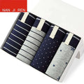 Set of four ice silk modal men’s boxer briefs in navy blue and gray with striped polka dot and star patterns multiple colour sets