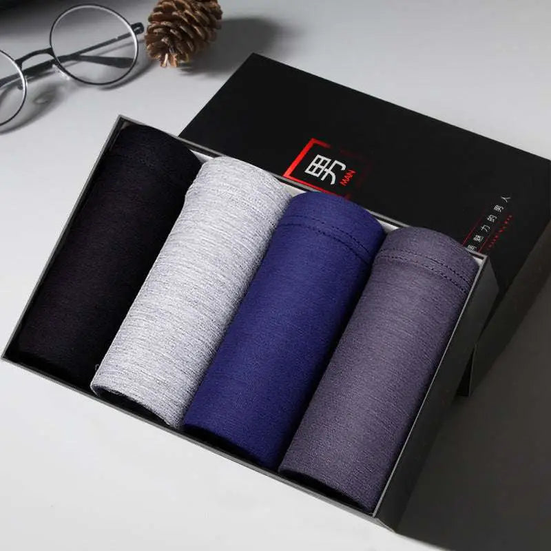 Set of ice silk modal men’s boxer briefs 4 pack in black heather gray navy blue and purple in a sleek gift box