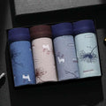 Set of four ice silk modal men’s boxer briefs in soft cotton with nature-themed prints and contrasting waistbands