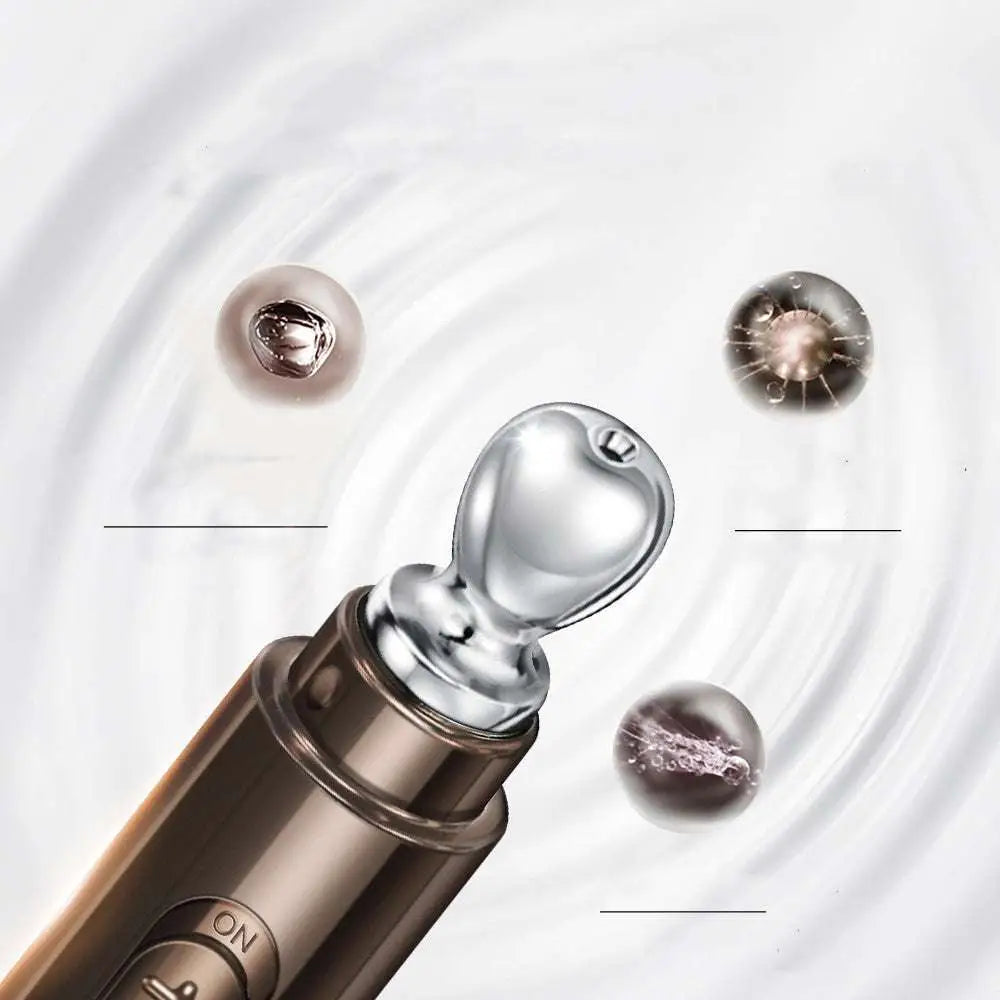 Silver-toned facial device with sleek cylindrical body and rounded tip for targeted skincare to improve eye bags with cream