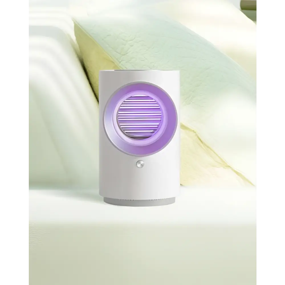 White cylindrical infant mosquito electric insect zapper with glowing purple light and horizontal slats for physical insect trap