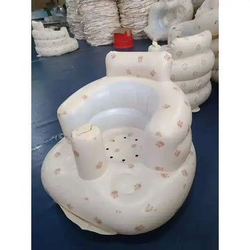 Inflatable baby chair with soft white exterior featuring pink cartoon animals and clear plastic lining for dining and bath use