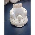 White inflatable baby chair with rainbow pattern designed for dining and bath use made of soft inflatable material