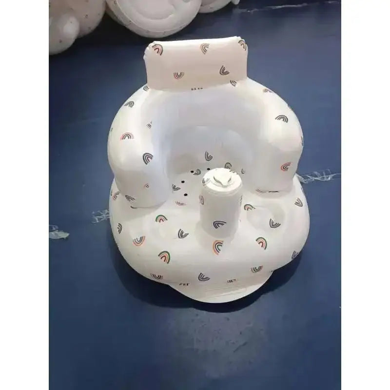 White inflatable baby chair with rainbow pattern designed for dining and bath use made of soft inflatable material
