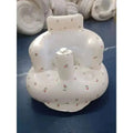 White inflatable baby chair with floral pattern and central pump designed for dining and bath use