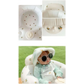 White inflatable baby chair with lemon and bee decals designed for dining and bath use
