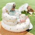 White inflatable baby chair with lemon and bee pattern designed for dining and bath use