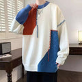 Cream-colored ins colorblock pullover sweater with bold blue and orange sections and textured cable-knit patterns for winter fashion knitted wear