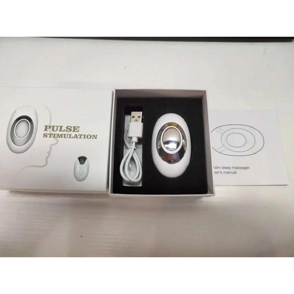 White oval-shaped palm sleep massager with silver metallic center and smooth plastic casing for intelligent relieve anxiety