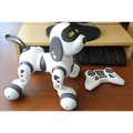 Intelligent remote control robot dog toy featuring a white and gray design with black led eyes resembling a playful puppy
