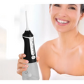 Black and silver handheld electric tooth punch with sleek ergonomic design and ipx8 waterproof electric feature