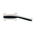 Black and white soft bristle shoe brush shown with iridescent hair care phototherapy led comb product