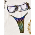 A shimmering iridescent rainbow bikini featuring a gradient swimsuit with purple blue and green hues on thong and bra top
