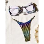 A shimmering iridescent rainbow bikini featuring a gradient swimsuit with purple blue and green hues on thong and bra top