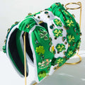 Irish green shamrock rhinestone knotted headband in green and white adorned with shamrock appliqués and rhinestones