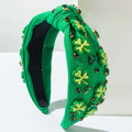 Vibrant green rhinestone knotted headband with light green irish green shamrock appliqués and emerald rhinestones