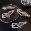 Shiny silver and rose gold irregular lines bang hair clips with sweet cool rhinestone accents for stylish wear