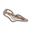 A gold-toned irregular lines bang hair clip with sweet cool rhinestone crystals and a larger crystal accent