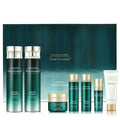 Isa knox focus prime double effect skincare set with sleek green and gold bottles and silver caps on dark teal backdrop