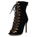 Black suede italian early autumn lace-up ankle boot with gold-tone eyelets and high stiletto heel