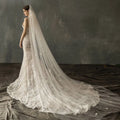 Ivory lace bridal church wedding gown with fitted bodice and elaborate pearl long tail floor-length train