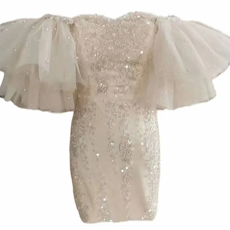 Ivory lace cinched waist miniskirt fairy dress with shimmering silver sequins and delicate tulle ruffle sleeves