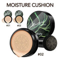 Ivory marbled air cushion foundation compact with black glossy lid, green swirl design, and beige cream foundation inside