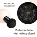 Black mushroom-shaped powder puff with textured dotted surface for cream foundation application in air cushion foundation compact