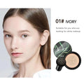 Ivory marbled air cushion foundation compact with black and green design and dotted sponge for cream foundation application