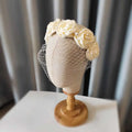 Elegant ivory satin rose hair hoop headdress adorned with delicate pearls and fine mesh veil for weddings