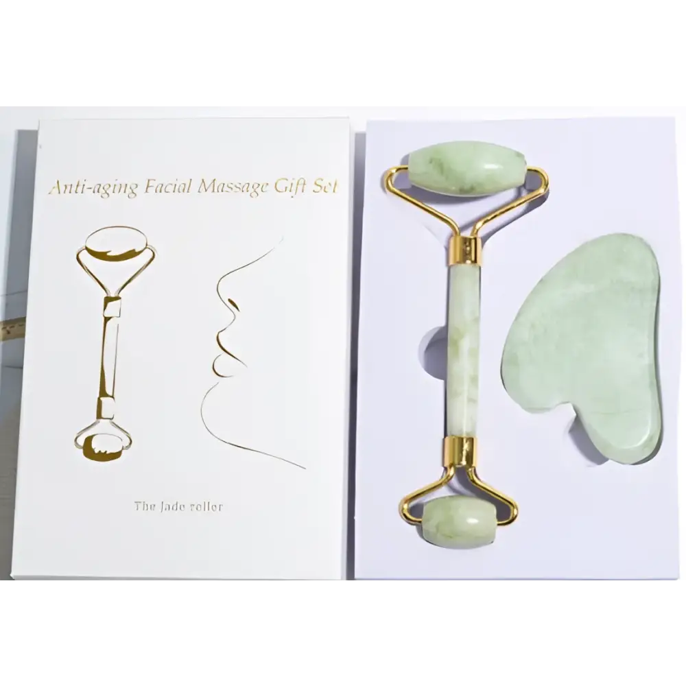 The jade roller in the gua sha gift set features smooth pale green stone rollers with gold-toned metal accents
