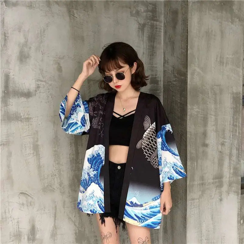 White kimono-style jacket with japanese wave print and fish prints featuring a flowing traditional design
